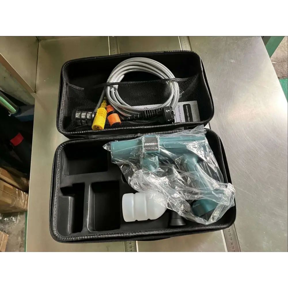 Multifunctional car wash pressure water gun in teal and white, packaged in a foam-lined carrying case with hose and connectors