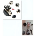Black and silver multifunctional electric shaver with rotary precision heads and multiple interchangeable grooming attachments