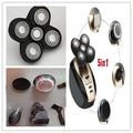 Multifunctional electric shaver in black and gold with five rotary precision heads and versatile grooming attachments