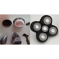 Black five-blade rotary precision heads with silver metallic cutting surfaces for versatile grooming in multifunctional electric shaver