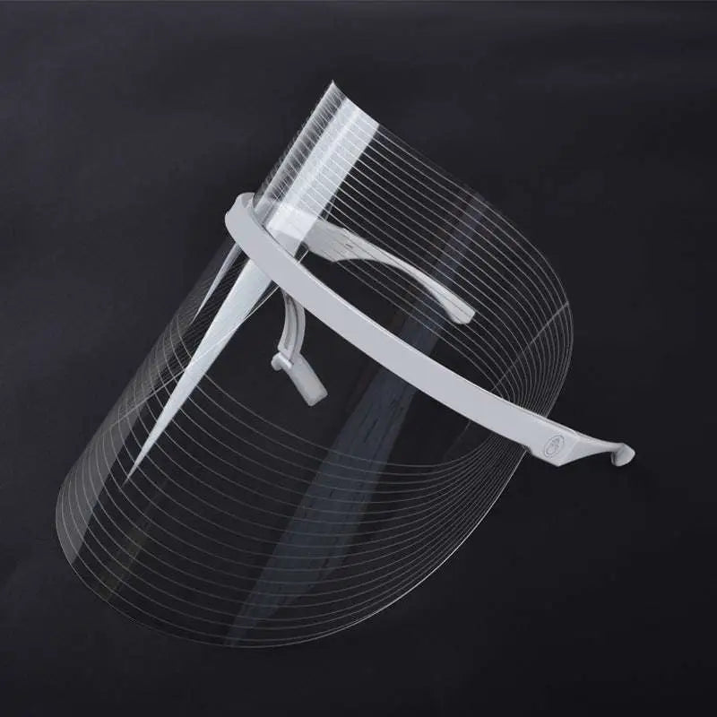 Clear plastic multifunctional facial massager led beauty mask with white adjustable headband and integrated ear loops