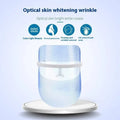 Transparent blue multifunctional facial massager led beauty mask with white frame and adjustable straps for skin whitening