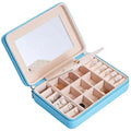 Light blue leather multifunctional jewelry storage box with built-in mirror and compartments for earrings and rings