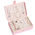 Pink leather multifunctional jewelry storage box with soft compartments hooks and built-in mirror for small accessories organization