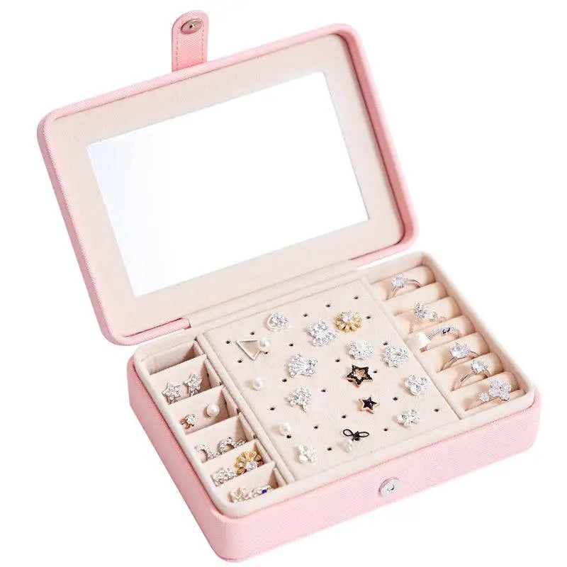 Pink leather multifunctional jewelry storage box with built-in mirror and compartments for earrings rings and studs