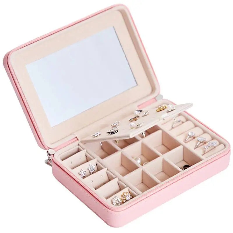 Pink leather multifunctional jewelry storage box with built-in mirror and segmented compartments for accessories