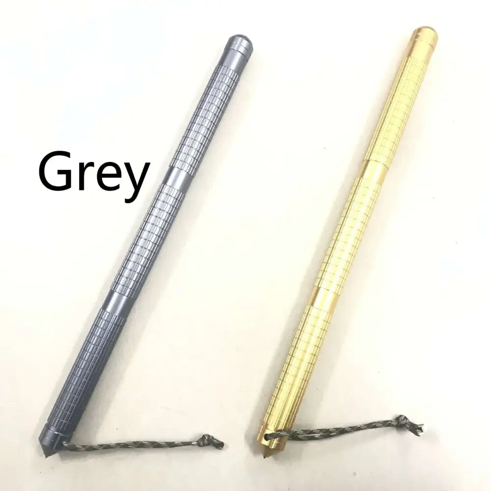 Grey and gold multifunctional self-defense stick made of tungsten steel with textured grip and attached braided cords