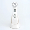 White multifunctional skin rejuvenation care instrument with five silver-tipped treatment heads and digital display