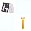 Gold-colored multifunctional skin rejuvenation care instrument with two spherical ends for effective skin rejuvenation