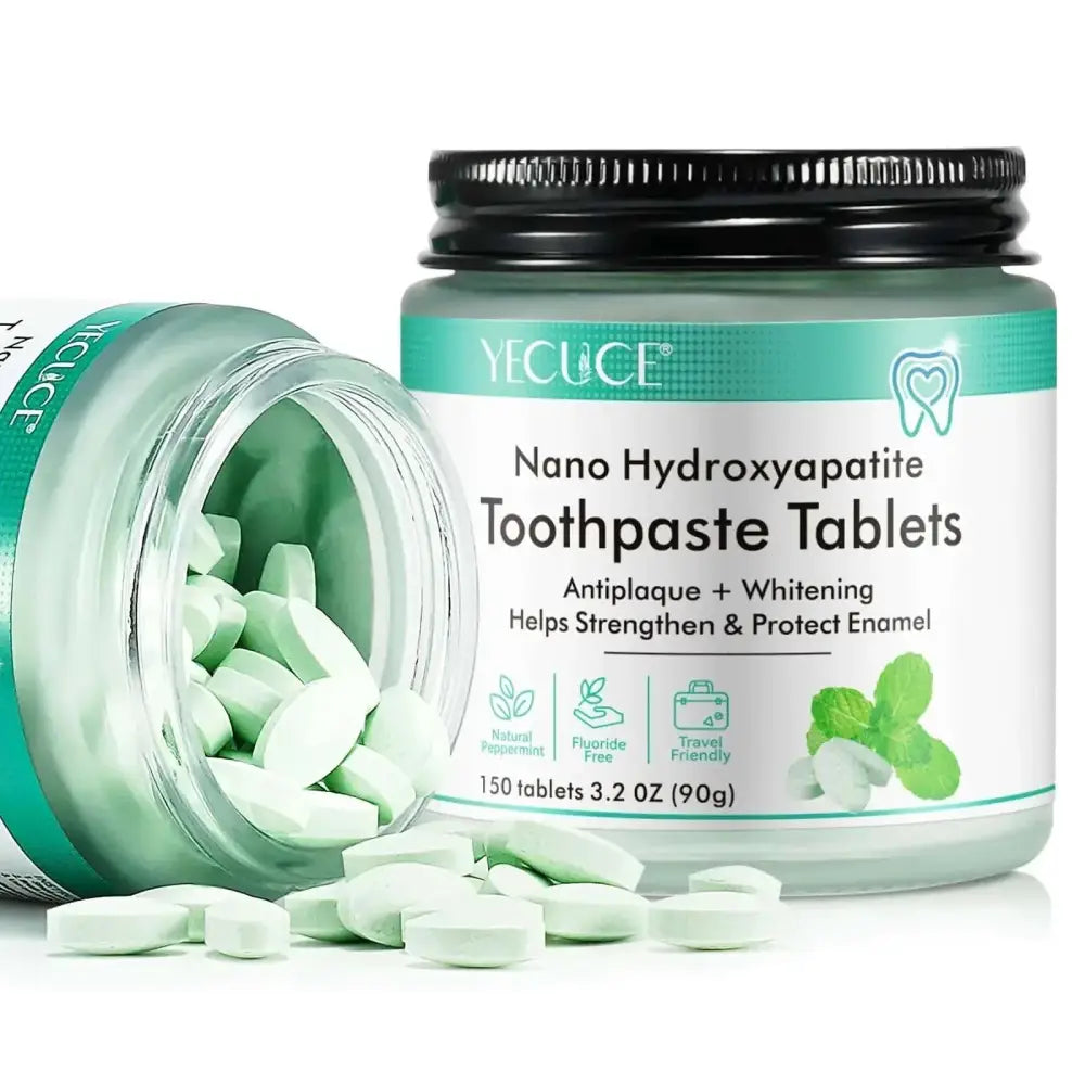 A clear glass jar with black lid containing light green oval nano hydroxyapatite toothpaste tablets by yecuce fluoride free
