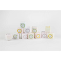 A natural citrus bath and body skincare set featuring pastel square shower steamers wrapped with jooss labels on white background