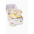 White embroidered eye mask with purple and pink floral designs and shhh label for natural citrus bath body skincare set