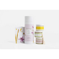 A tall white cylindrical container with floral illustrations for natural clay mask body skincare products and home spa use