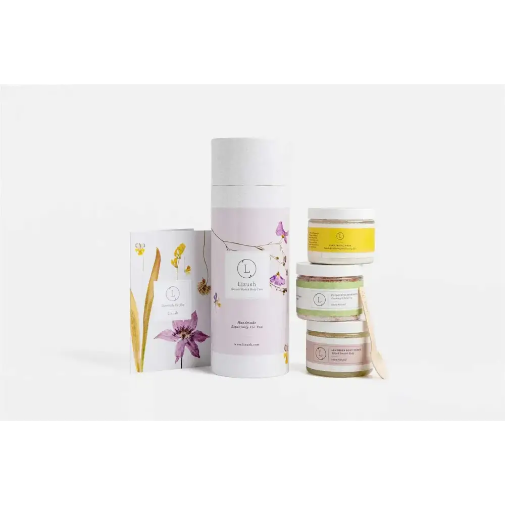 A tall white cylindrical container with floral illustrations for natural clay mask body skincare products and home spa use