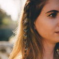 Silver hoop bead hair ties with small turquoise natural lycopose stone beads worn on braided light brown hair