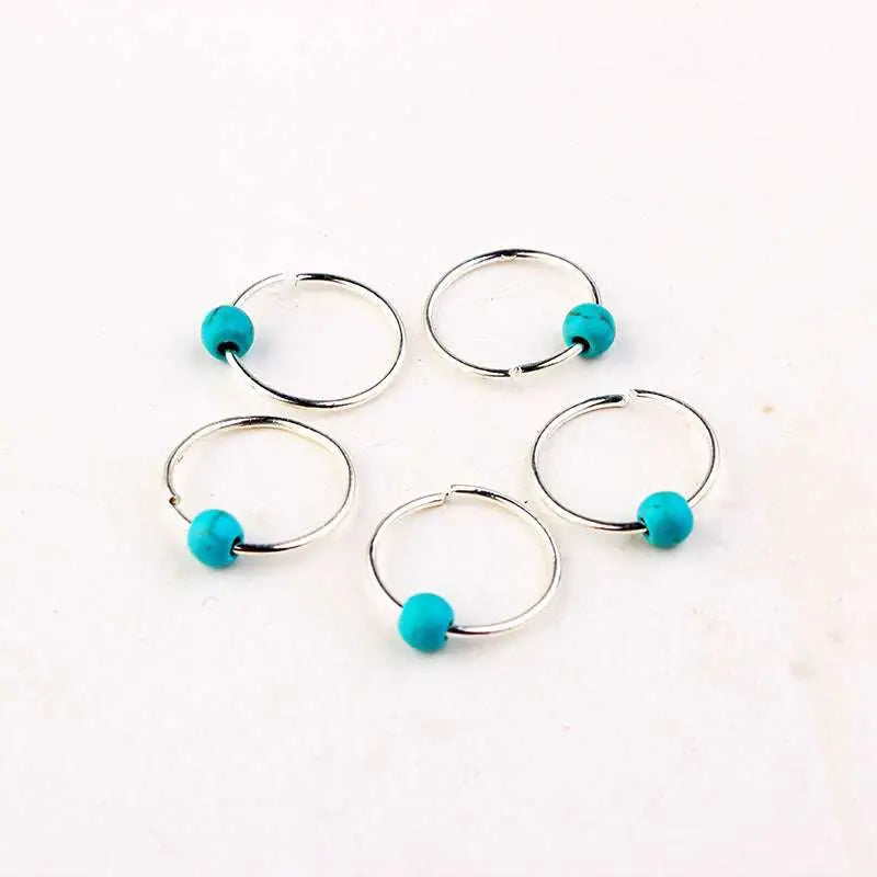 Set of five silver metal ring stitch markers with vibrant turquoise beads featuring natural lycopose stone accents