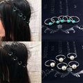 Silver hair cuffs with turquoise and pearl beads on natural lycopose stone decorated wood bead hair ties