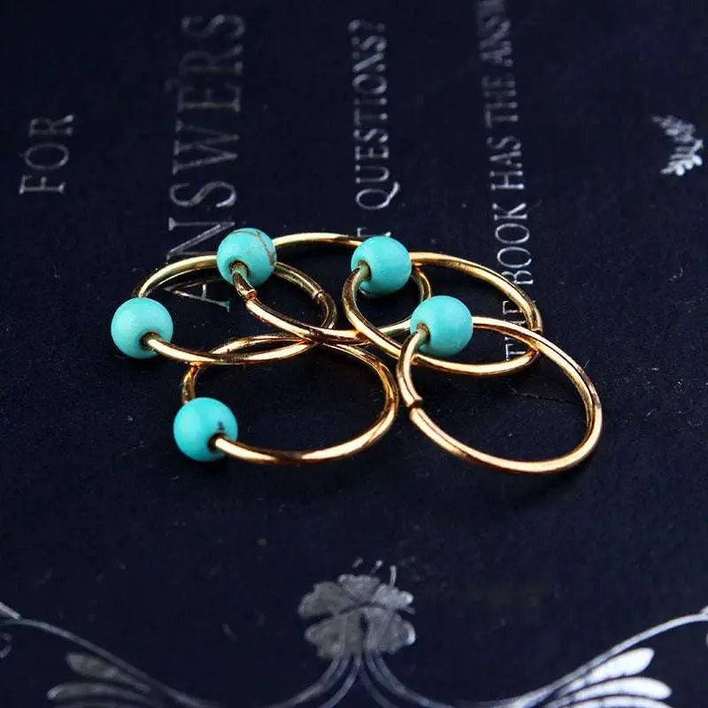 Gold-colored metal rings with turquoise beads on natural lycopose stone decorated bead hair ties for hair styling