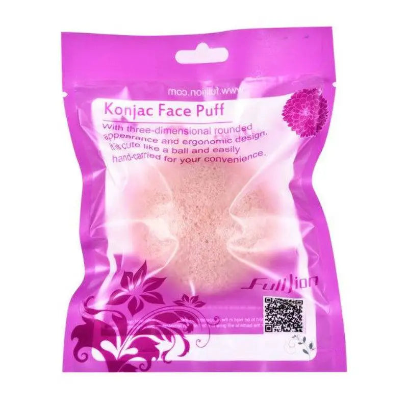 A pink natural round shap konjac sponge face cleaning puff in purple and white floral packaging bag