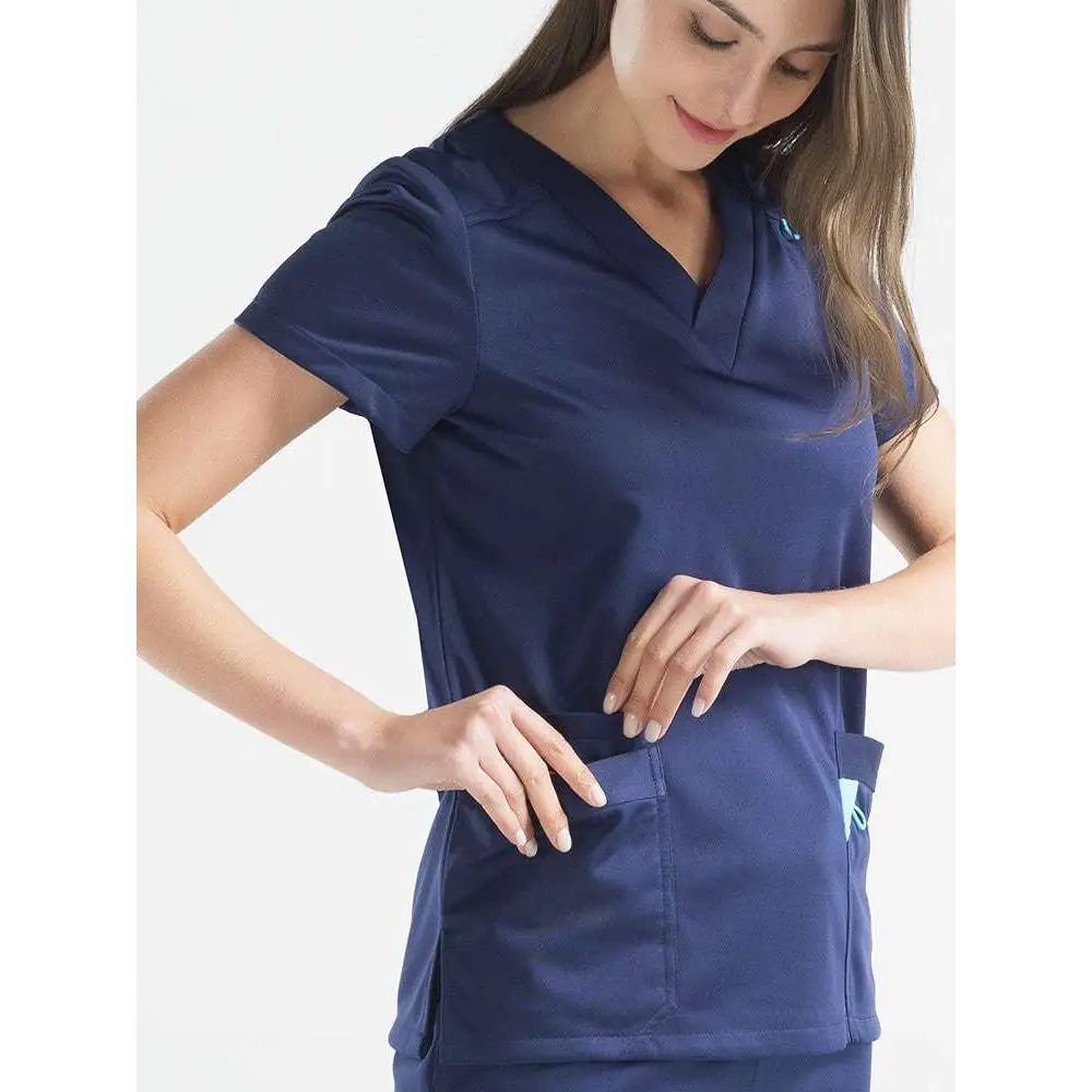 Navy blue short-sleeved scrub top with v-neck and side pockets in salon workwear set for beauty salon nail technicians