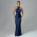 Navy blue elegant backless sleeveless satin gown with a sleek halter neck fitted silhouette and flared skirt