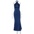 A navy blue elegant backless sleeveless satin gown with a fitted silhouette and subtle side slit