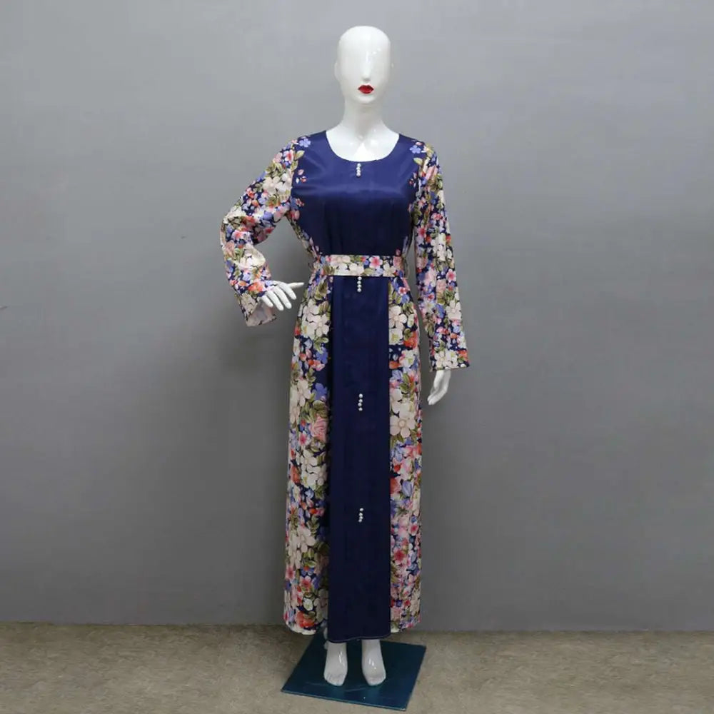 A navy blue floral east print dress with long sleeves and a fitted waistband suitable as a print dress muslim
