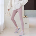 Navy blue high waist elastic threaded underwear leggings styled with soft blush pink ribbed leggings and winter coat
