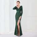 Emerald green sequined evening dress with long sleeves and high slit in contrast to navy blue long sleeve sequined gown