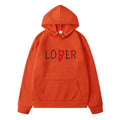 Orange winter clothes hoodie with loser printed in black and a red slash through the i for navy blue lover collection