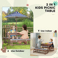 Navy blue outdoor wooden kids picnic table set with blue and white striped umbrella and wooden pole attached