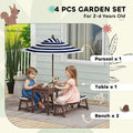 Navy blue outdoor wooden kids picnic table set with a blue and white striped parasol and wooden handle