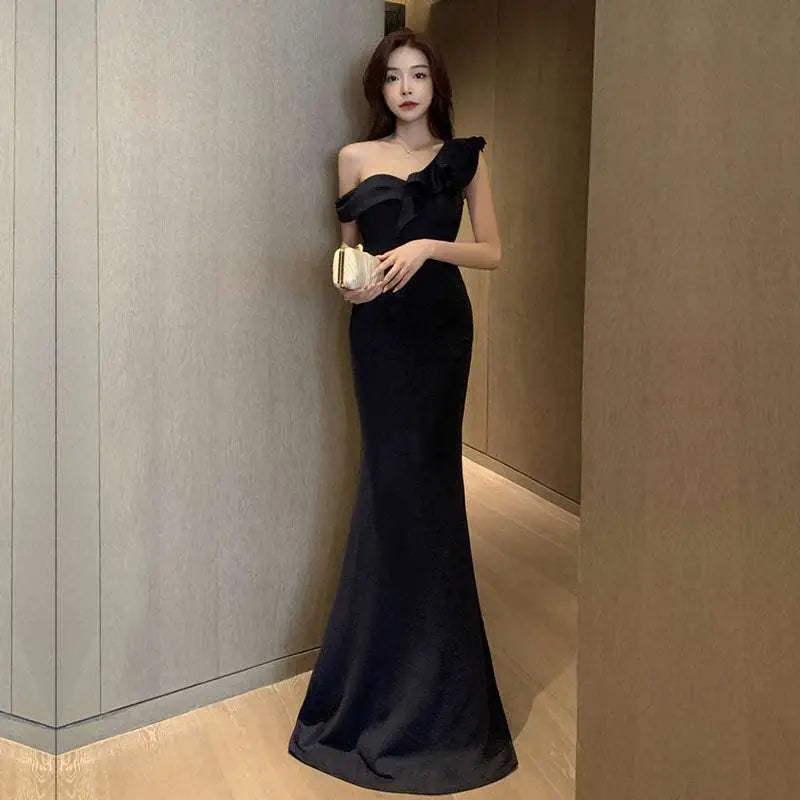 Black velvet one-shoulder satin mermaid gown with ruffled bow at neckline in celebrity French style for parties