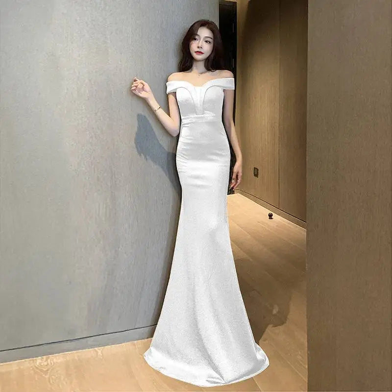 A sleek white satin mermaid gown with off-the-shoulder neckline in celebrity french style for party temperament celebrity