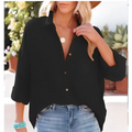 Black button-up blouse with three-quarter sleeves and relaxed fit paired with navy dropped shoulder bat shirt detail