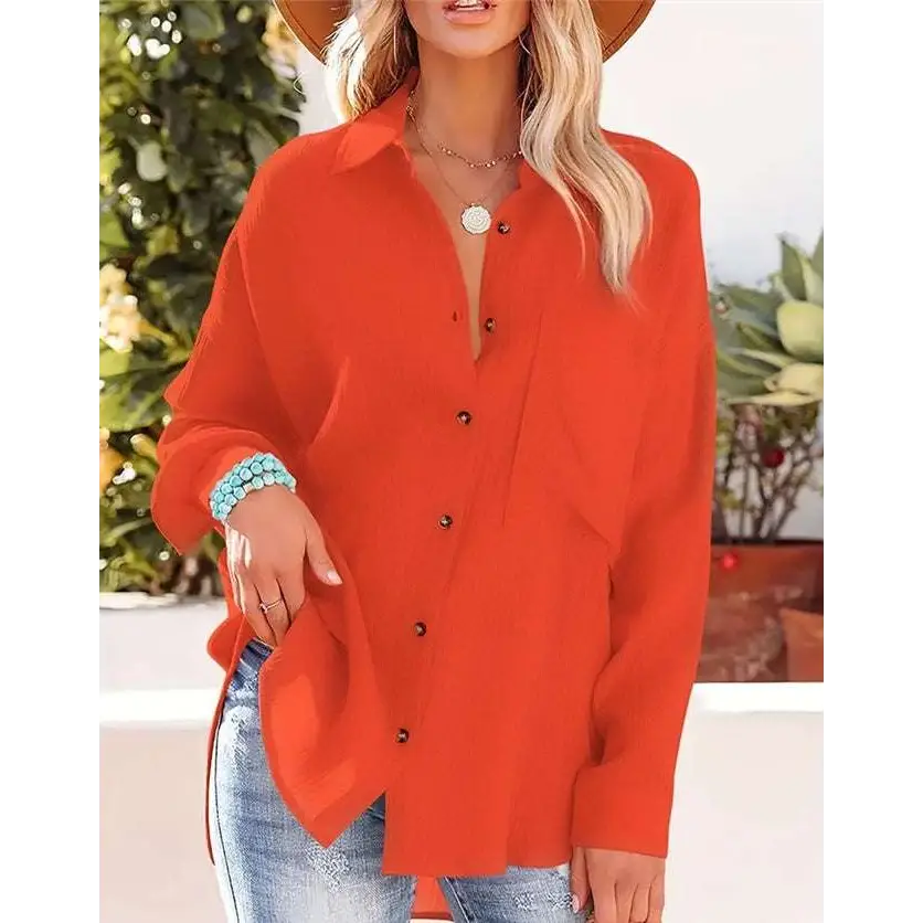 Vibrant orange long-sleeved shirt with relaxed fit side slits designed in a casual dropped shoulder bat style
