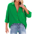 Vibrant green loose-fitting button-up shirt with rolled cuffs and ribbed texture resembling a navy dropped shoulder bat shirt