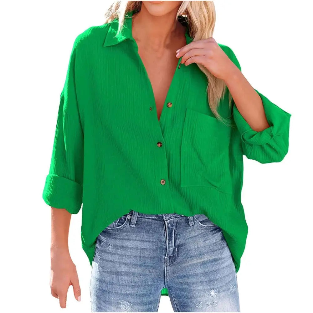 Vibrant green loose-fitting button-up shirt with rolled cuffs and ribbed texture resembling a navy dropped shoulder bat shirt
