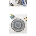 Circular carpet floor mat with intricate navy mandala ethnic style patterns in blue and white with cream fringe