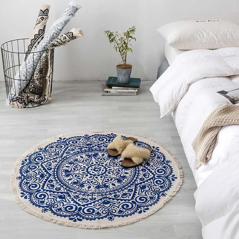 Navy mandala ethnic style round carpet floor mat in blue and white with circular pattern and fringed edges