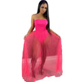 A vibrant fuchsia strapless gown with a fitted bodice and flowing pleated tulle skirt featuring a wrapped chest design