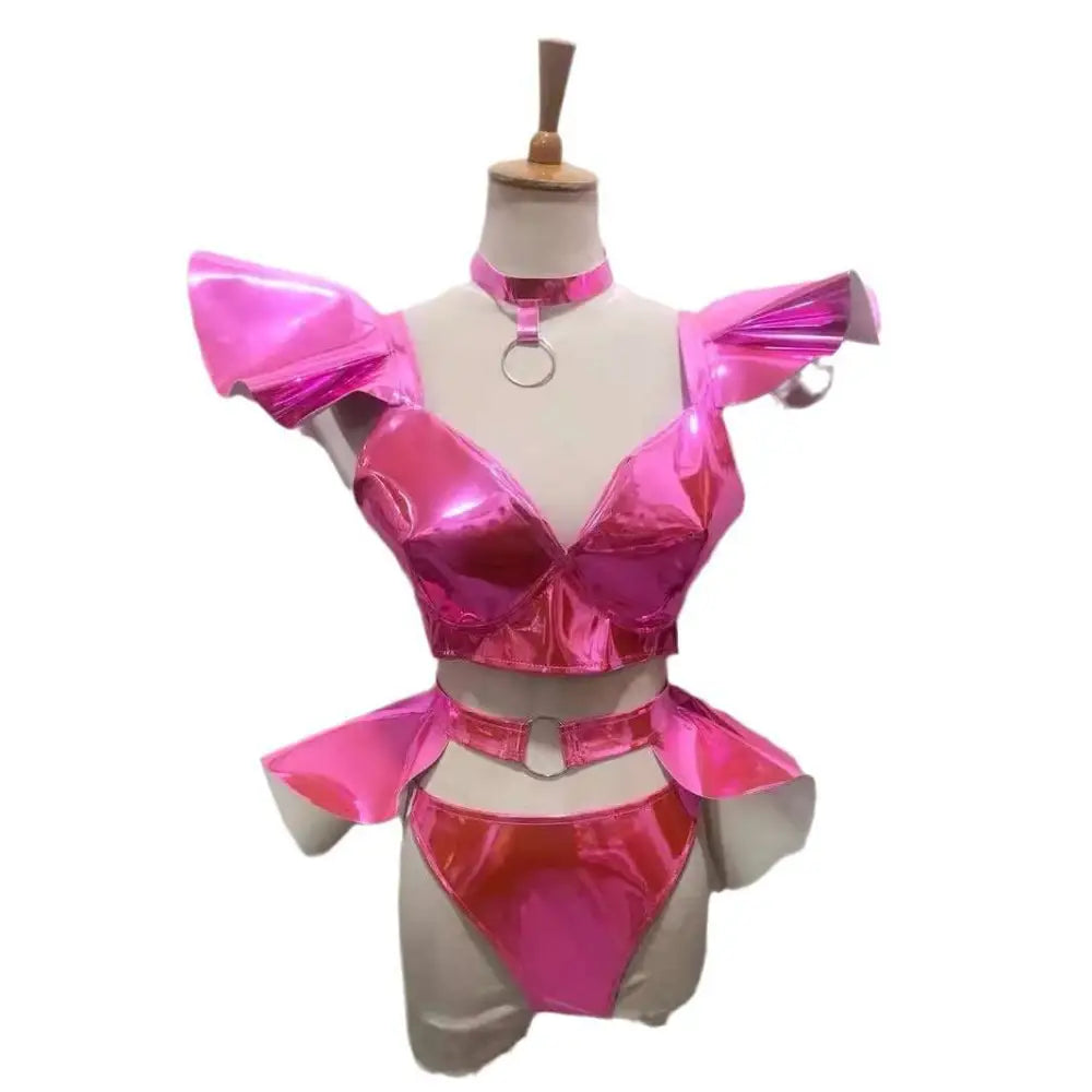 Shiny pink metallic two-piece stage costume with ruffled shoulder details and peplum waistband for performance