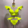 Neon yellow metallic two-piece stage costume with ruffled shoulder straps and matching patent leather belt