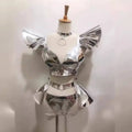 Shiny silver metallic two-piece stage outfit with ruffled shoulder accents and matching belt for neon yellow stage costume