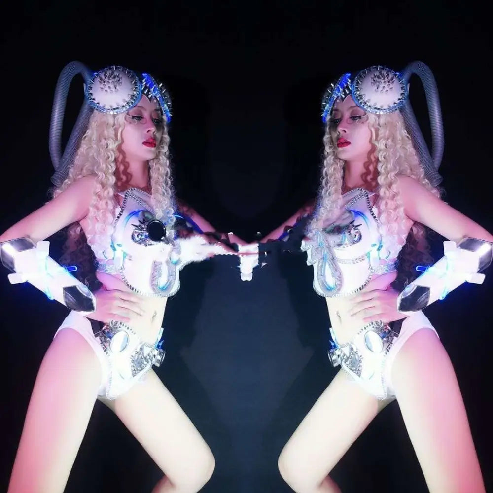 Futuristic white and blue led-lit future technology suit with metallic embellishments and glowing headpiece from night elf shop bar