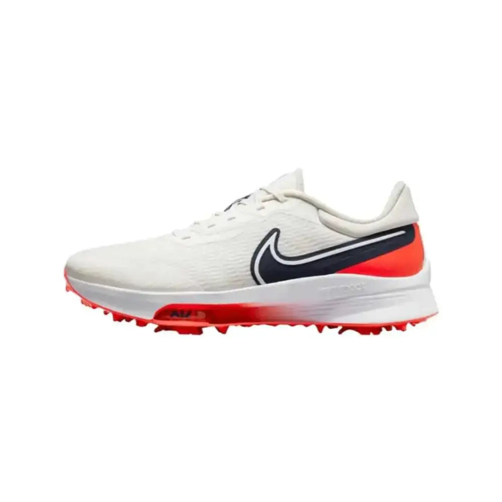 White nike air zoom infinity tour mens golf shoe with black swoosh textured upper and red spiked sole for traction