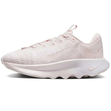 A soft blush pink nike motiva womens walking shoe size 7 with breathable mesh upper and chunky white midsole