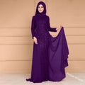 A noble elegant slim purple sequined evening gown featuring a sheer overlay and long sleeves for formal occasions