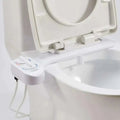White plastic non-electric bidet with adjustable nozzle and control dial for water pressure regulation and spray functions