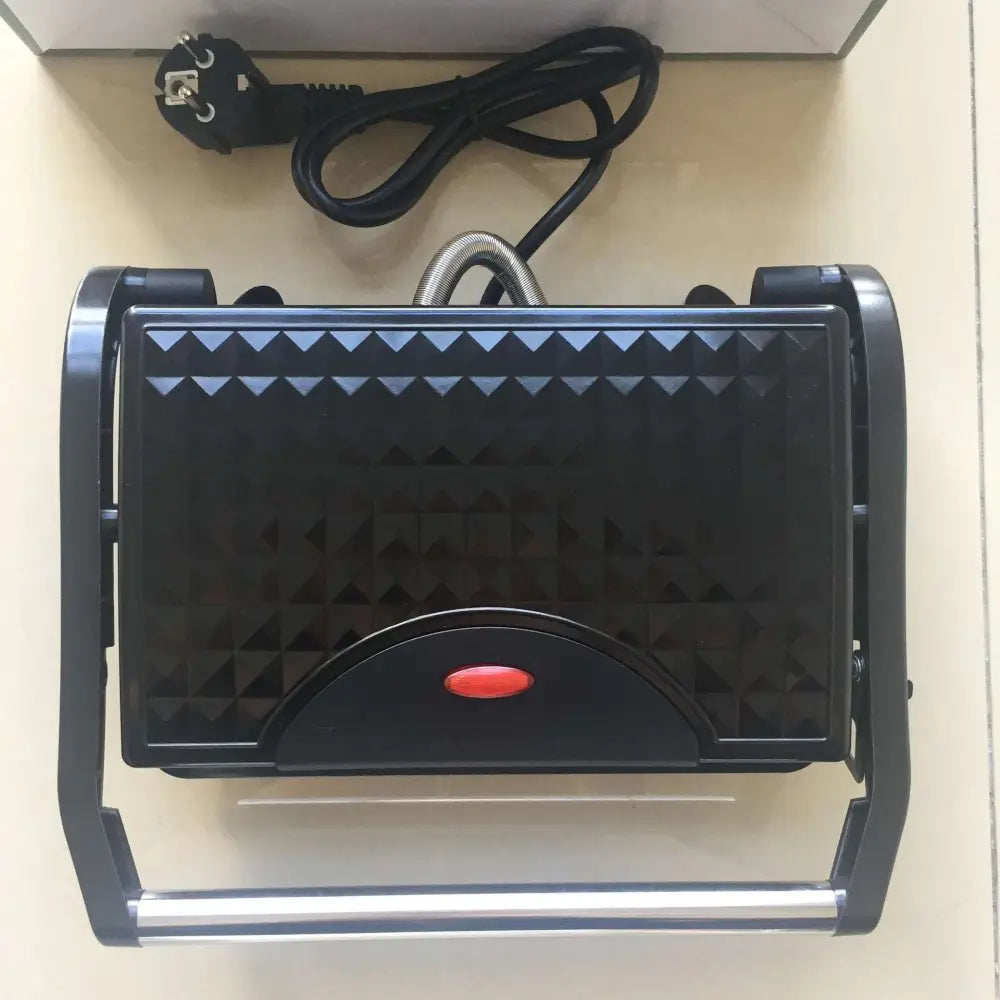 Black nonstick electric grill with textured diamond ribbed grilling surface and red power button steak maker